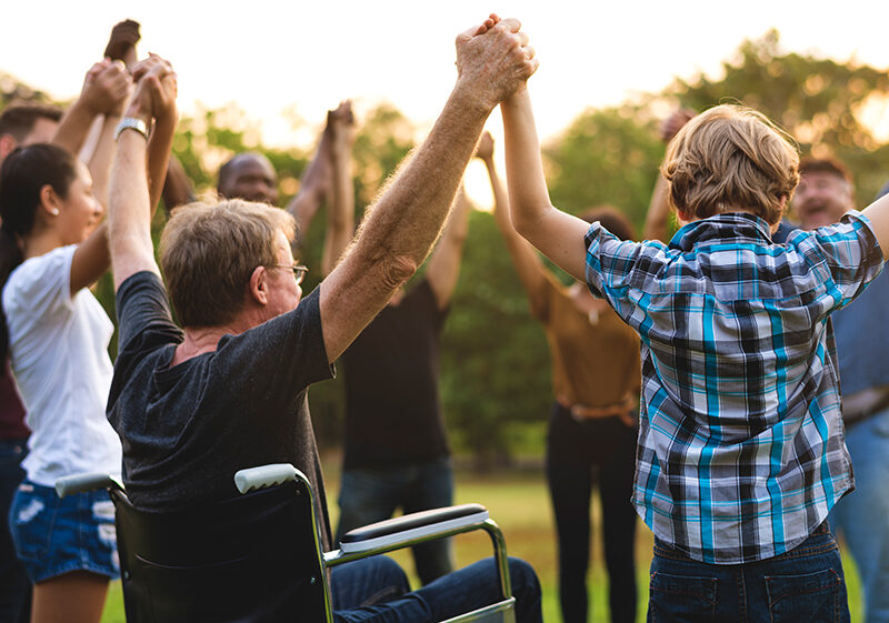 Group of people holding handssupport team unity