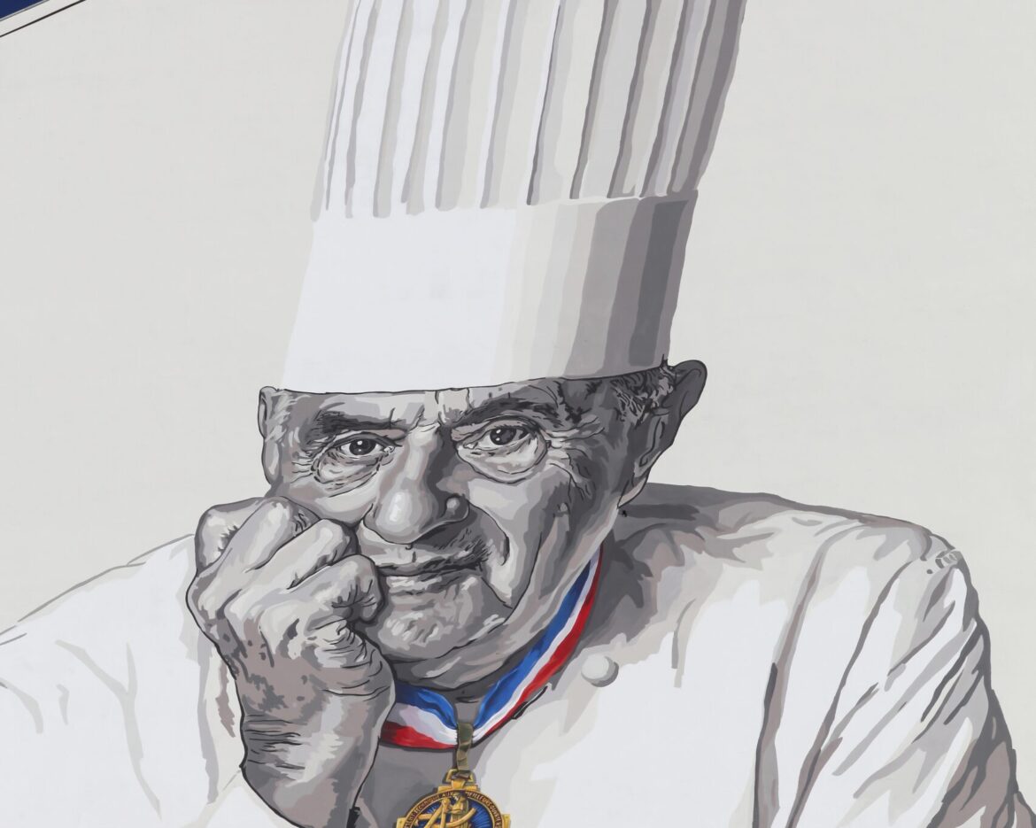 Lyon, France – March 26, 2016: Facade in Lyon with Paul Bocuse portrait. Paul Bocuse, 3 stars at the Michelin guide, is a french chef based in Lyon who is famous for the high quality of his restaurant