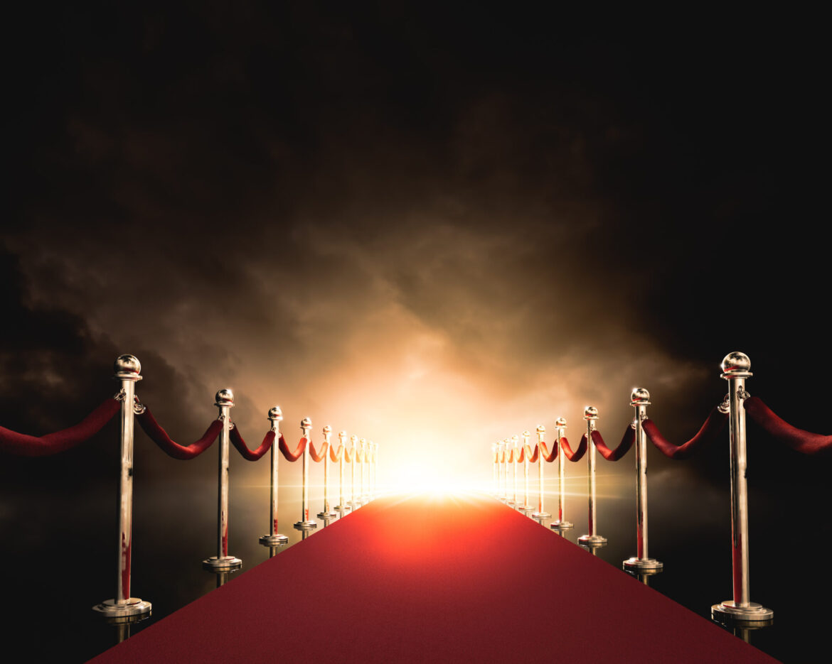 Red carpet with bright light in the end / 3D illustration